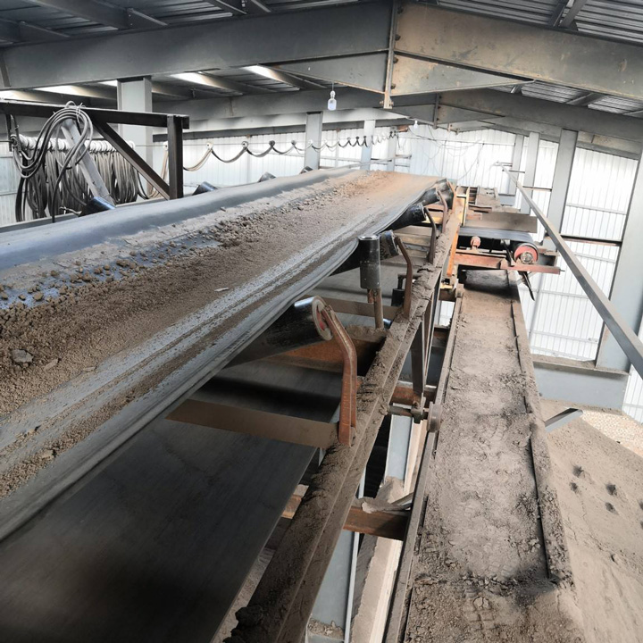 What is the purpose of a clay belt conveyor?